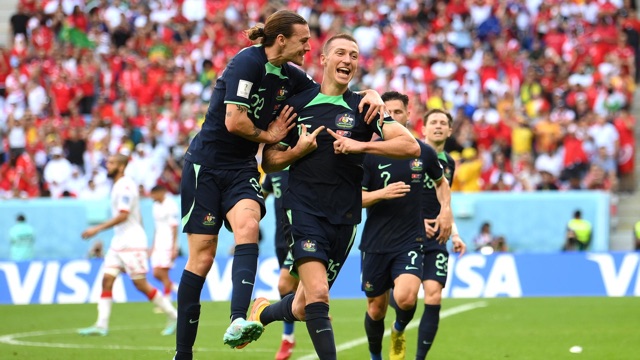 Socceroos players applauding fans
